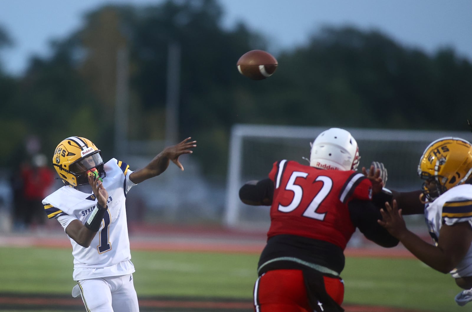 Springfield's Christopher Wallace throws a pass against Trotwood-Madison on Friday, Sept. 5, 2025, at Trotwood. David Jablonski/Staff