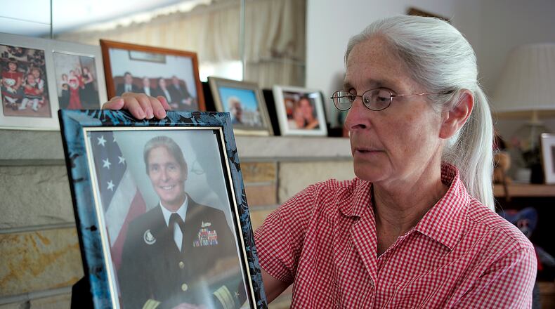 Retired Rear Admiral Deborah Loewer looks over her Navy picture Thursday, Sept. 8, 2016. Loewer was in charge of the White House Situation Room on Sept. 11, 2001. Bill Lackey/Staff