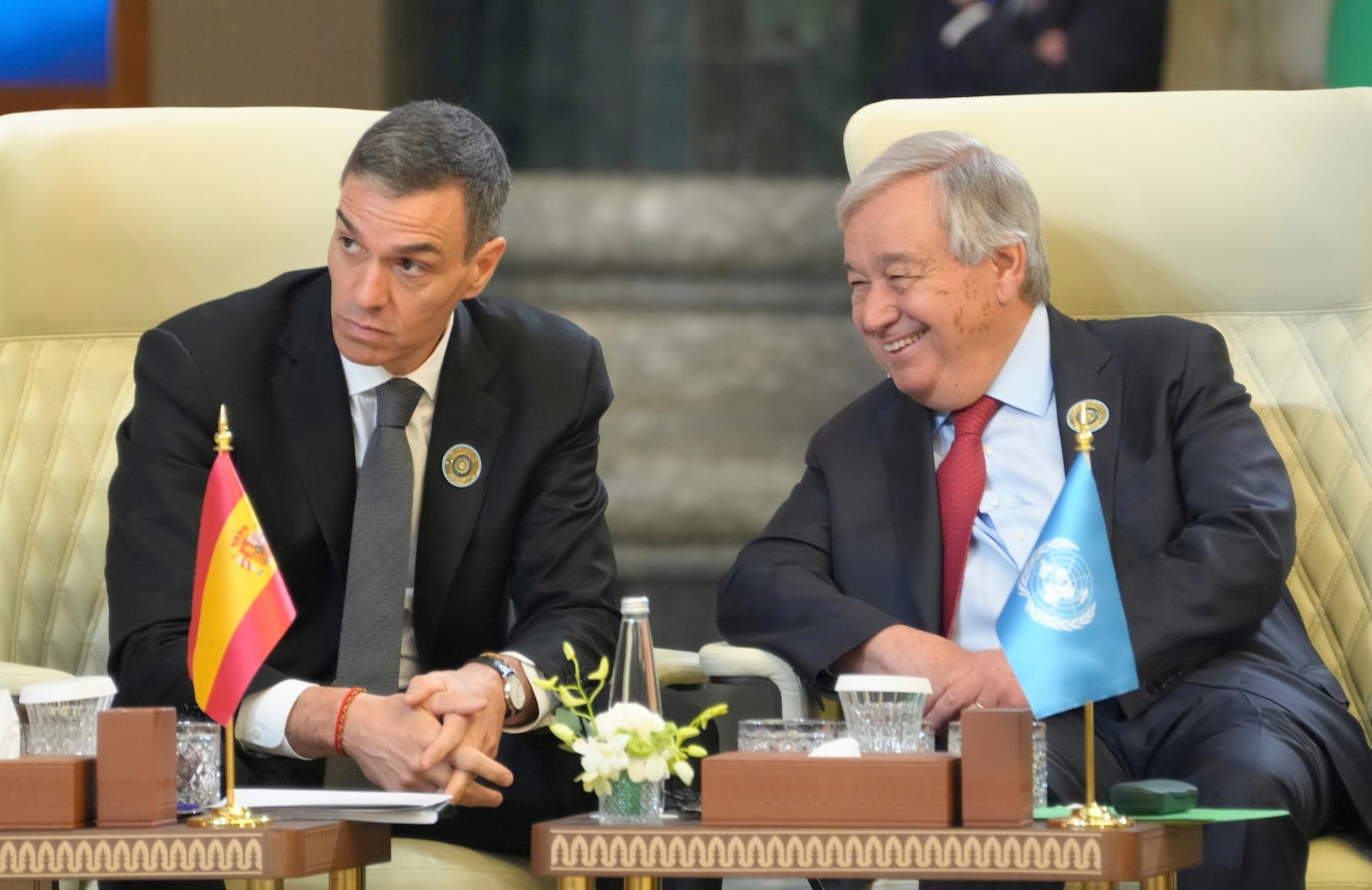 Spanish Prime Minister Pedro Sanchez and UN Secretary General Antonio Guterres attends the 34th Arab League summit, in Baghdad, Iraq, Saturday, May 17, 2025. (AP Photo/Hadi Mizban)