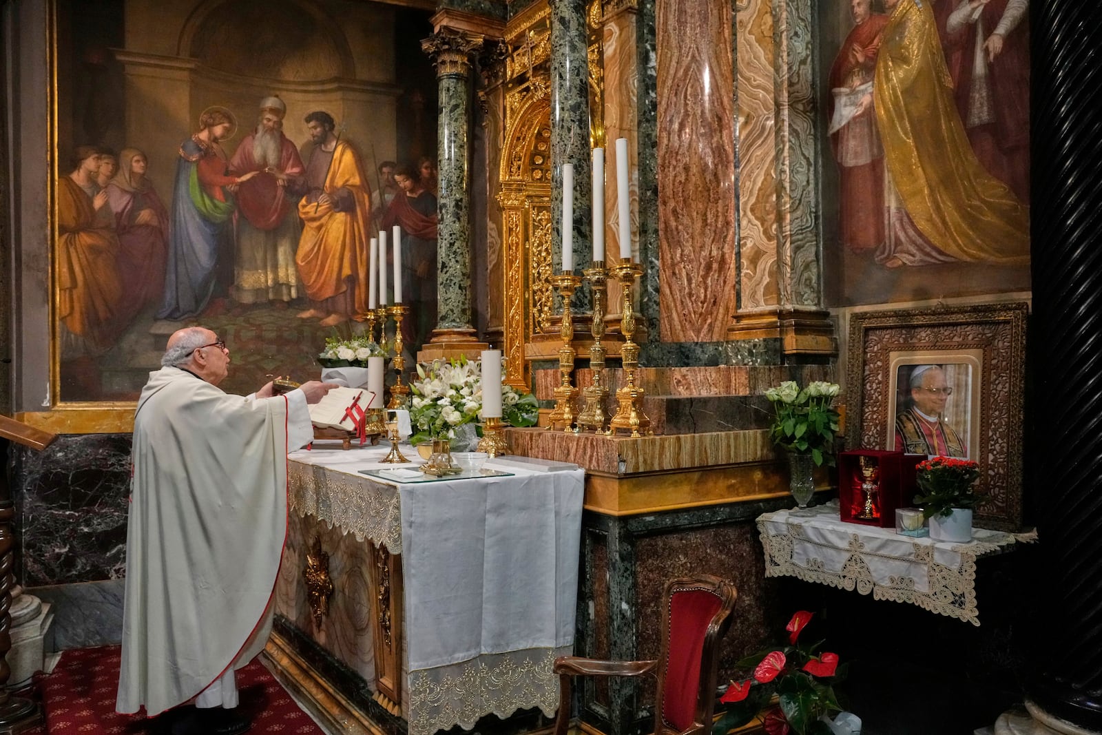 Augustinian friar Paolo Angelone celebrates Mass in the Sanctuary of Our Mother of Good Counsel in Genazzano, Italy, Thursday, May 15, 2025. (AP Photo/Gregorio Borgia)