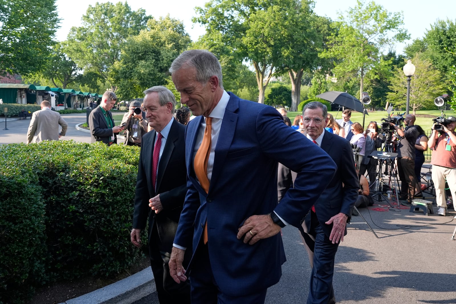 Senate Majority Leader John Thune, R-S.D., Sen. John Barrasso, R-Wyo., right, and Sen. Mike Crapo, R-Idaho, walks from the microphones after speaking with reporters following their meeting with President Donald Trump at the White House, Wednesday, June 4, 2025, in Washington. (AP Photo/Alex Brandon)