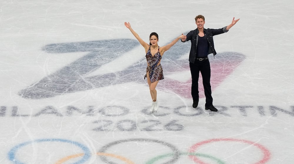 Madison Chock and Evan Bates of the United States compete during the figure skating ice dance team event at the 2026 Winter Olympics, in Milan, Italy, Friday, Feb. 6, 2026. (AP Photo/Ashley Landis)