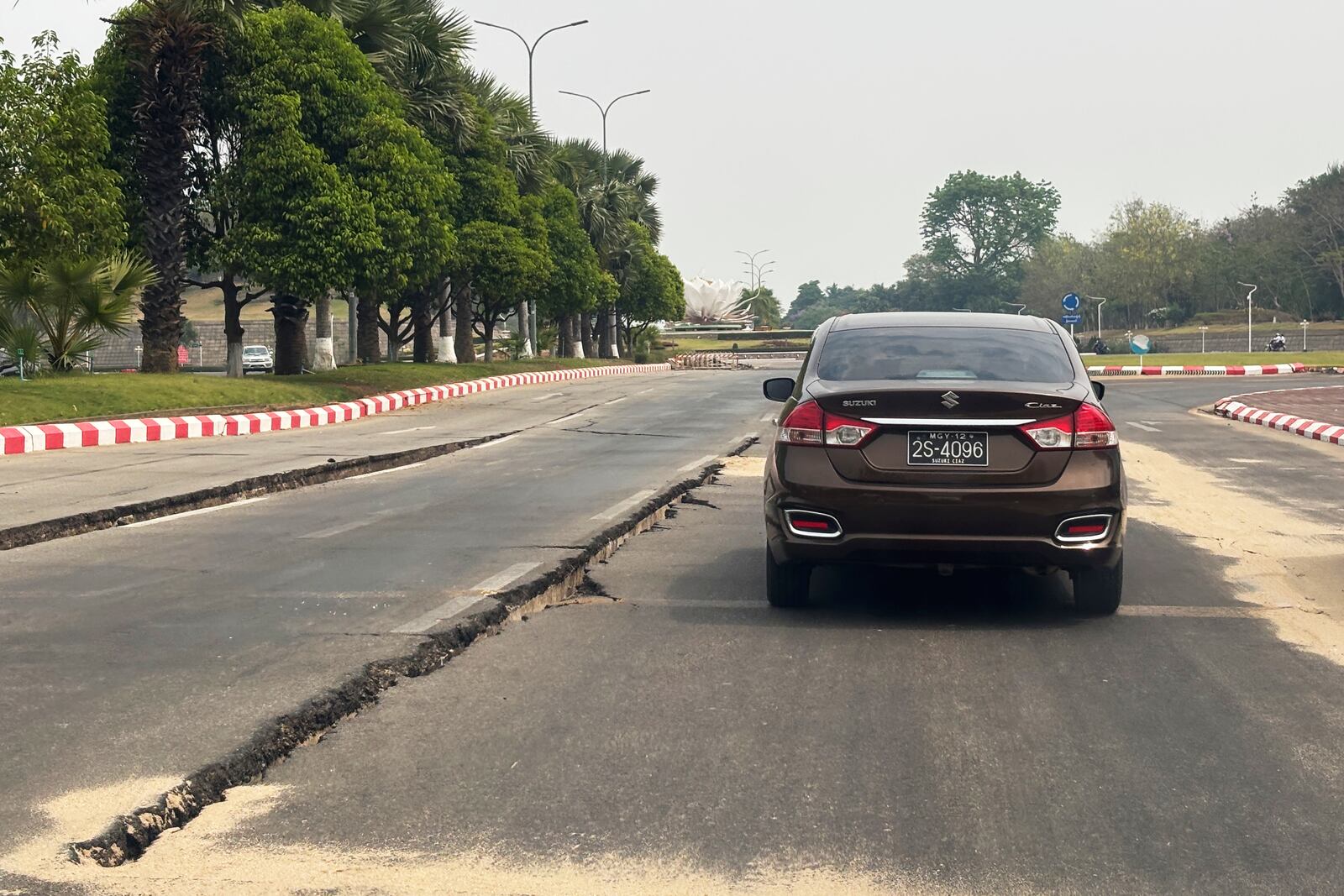 A car makes its way through a road damaged in the aftermath of the March 28 earthquake in Naypyitaw, Myanmar, Thursday, April 10, 2025. (AP Photo)
