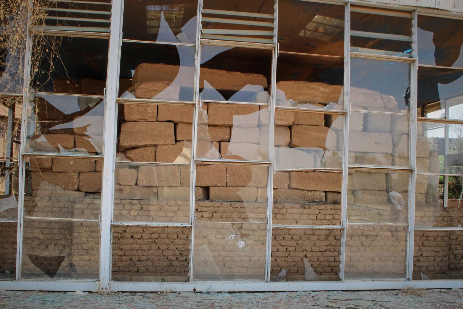 Windows of Sudan National Museum, the home to the country's largest artifacts that date to different eras of Sudanese history, are shattered after nearly two years of war between the army and paramilitary Rapid Support Forces (RSF), in Khartoum, Sudan, Thursday, April 3, 2025. (AP Photo/Khaled Abd Al Gader)
