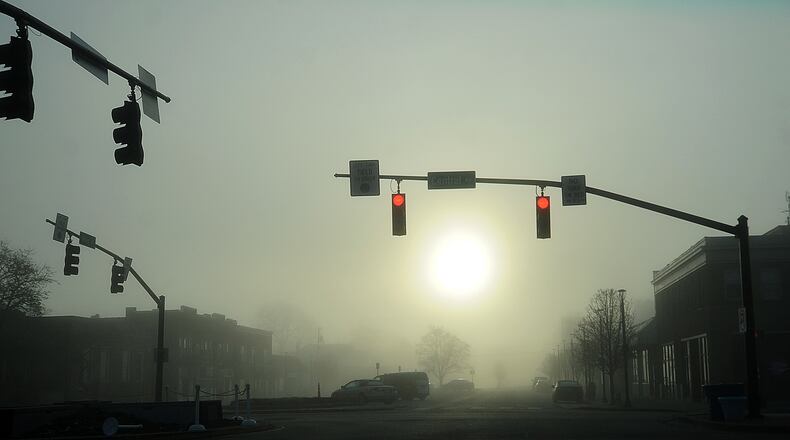 Early morning fog in downtown Fairborn Tuesday, March 28, 2023. MARSHALL GORBY\STAFF