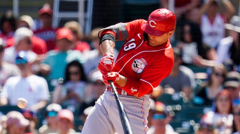 Cincinnati Reds' Joey Votto connects for an RBI double against the Arizona Diamondbacks during the second inning of a spring training baseball game Sunday, April 3, 2022, in Scottsdale, Ariz. (AP Photo/Ross D. Franklin)