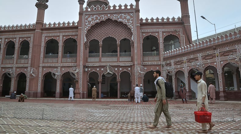 Muslim worshippers arrive to observes "Itikaf," during the last ten days of the Islamic fasting on month of Ramadan, at a mosque, in Peshawar, Pakistan, Tuesday, March 10, 2026. (AP Photo/Muhammad Sajjad)