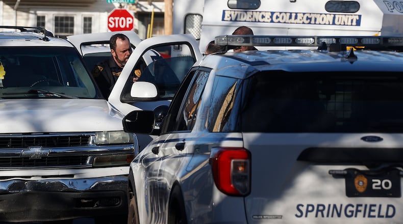 The Springfield Police Division investigate a Chevy Tahoe, parked along Mason Street, where a man was found with a suspected gunshot wound to the head Tuesday, Feb. 6, 2024. BILL LACKEY/STAFF