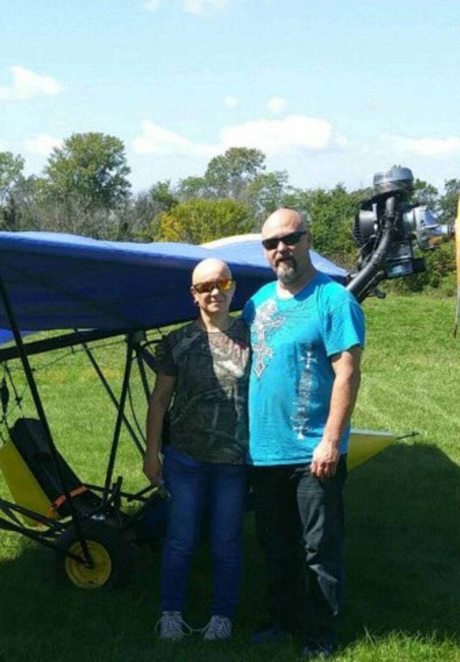 Linda Lewis (left) and Doug Lewis (right) stand in front of the ultralight plane that crashed on Sunday. Contributed.