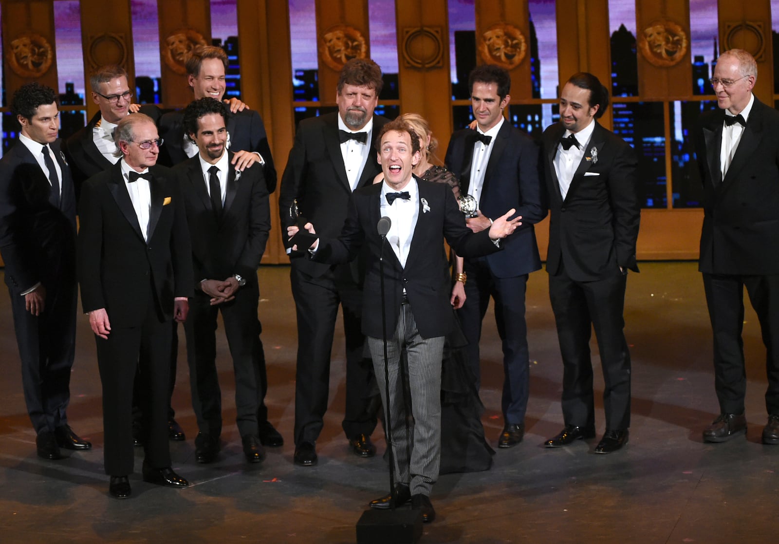 FILE - Jeffrey Seller, center, producer of the Broadway musical "Hamilton" accepts the award for best musical at the Tony Awards in New York on June 12, 2016. (Photo by Evan Agostini/Invision/AP, File)