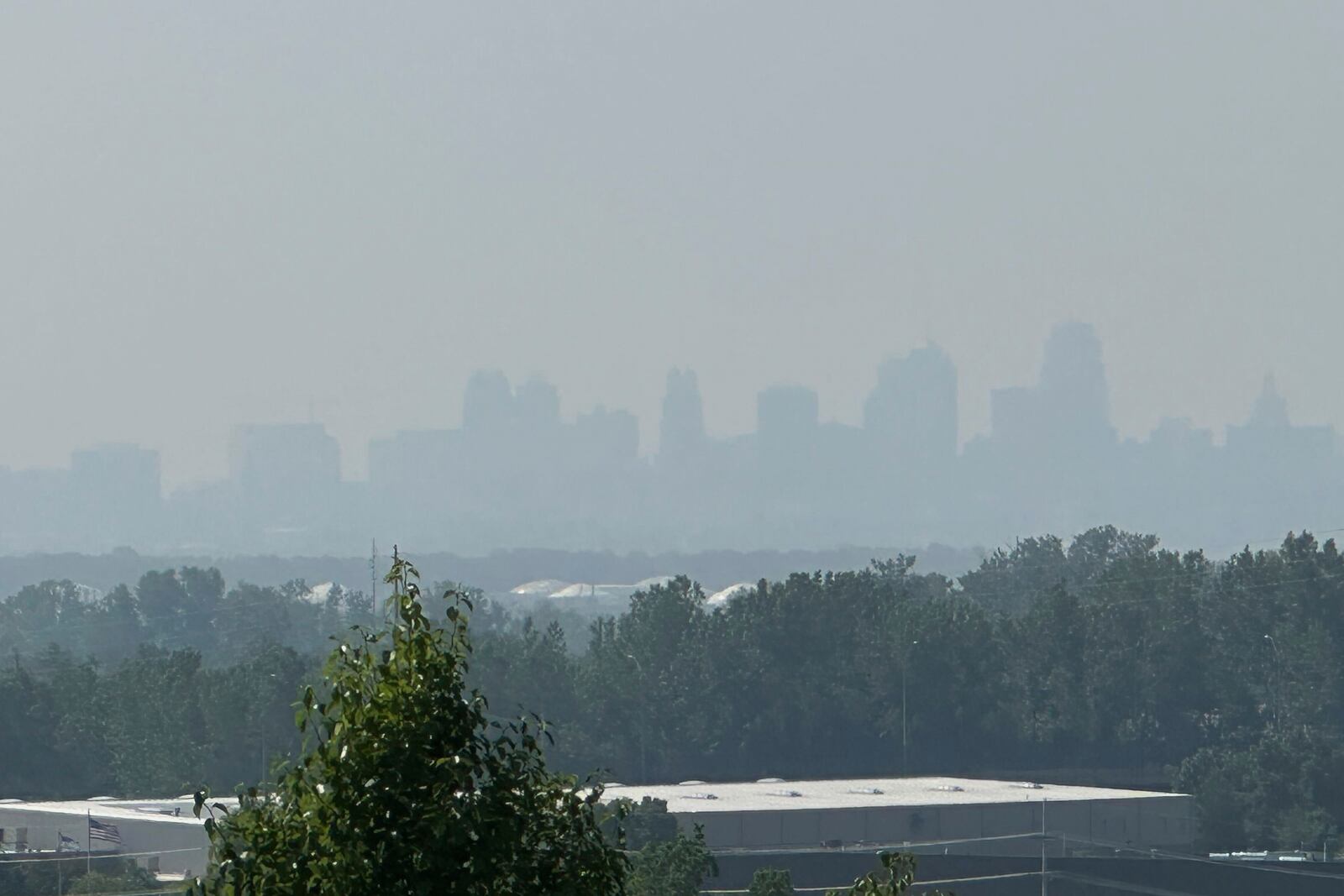 Smoke from Canadian wildfires can be seen partially obscuring the skyline of downtown Kansas City, Missouri on Wednesday, June 4, 2025. (AP Photo/Nick Ingram)