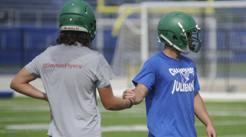 Noah Burneka (left) and Rocky Stark get defensive. Chaminade Julienne held its first day of preseason high school football practice on Monday, July 31, 2017. MARC PENDLETON / STAFF