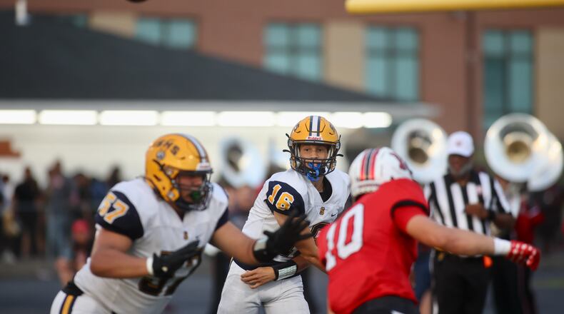 Springfield's Brent Upshaw throws a pass against Wayne on Friday, Sept. 8, 2023, in Huber Heights. David Jablonski/Staff