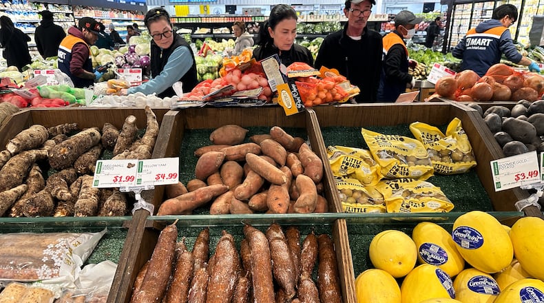 Shoppers shop at a grocery store in Schaumburg, Ill., Monday, Feb. 9, 2026. (AP Photo/Nam Y. Huh)