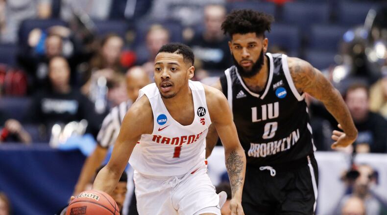 DAYTON, OH - MARCH 13: Carlik Jones #1 of the Radford Highlanders is pursued by Joel Hernandez #0 of the Long Island Blackbirds during the second half of the First Four game in the 2018 NCAA Men’s Basketball Tournament at UD Arena on March 13, 2018 in Dayton, Ohio. (Photo by Joe Robbins/Getty Images)