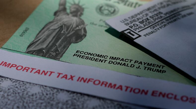 FILE - A picture of a stimulus check issued last year. (AP Photo/Eric Gay)
