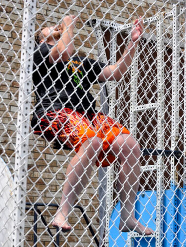 Sun columnist Andy McGinn sits in a dunking tank for charity