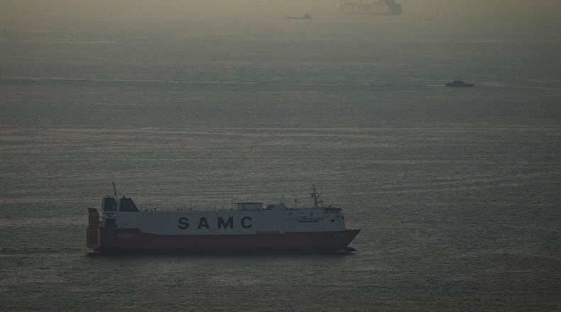 Cargo ships sail in the Arabian Gulf towards Strait of Hormuz in United Arab Emirates, Thursday, March 19, 2026. (AP Photo)