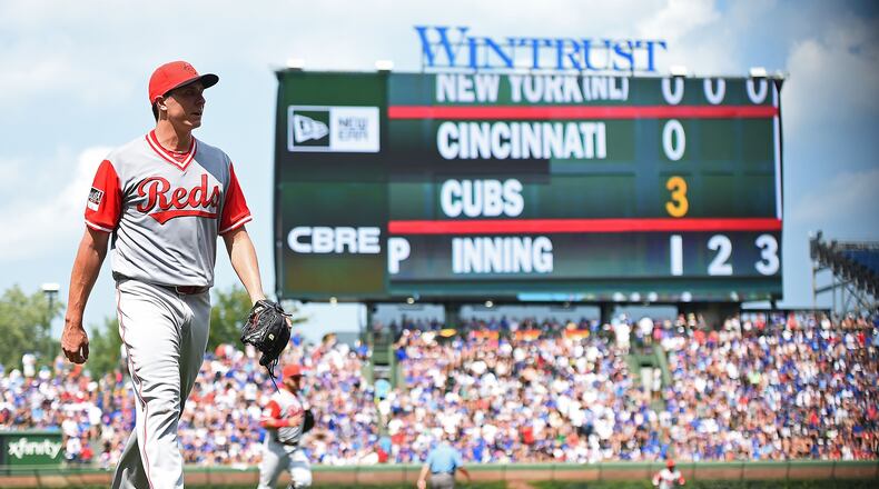 CHICAGO, IL - AUGUST 26: Homer Bailey #34 of the Cincinnati Reds walks to the dugout after the first inning against the Chicago Cubs at Wrigley Field on August 26, 2018 in Chicago, Illinois. All players across MLB will wear nicknames on their backs as well as colorful, non traditional uniforms featuring alternate designs inspired by youth-league uniforms during Players Weekend. (Photo by Stacy Revere/Getty Images)
