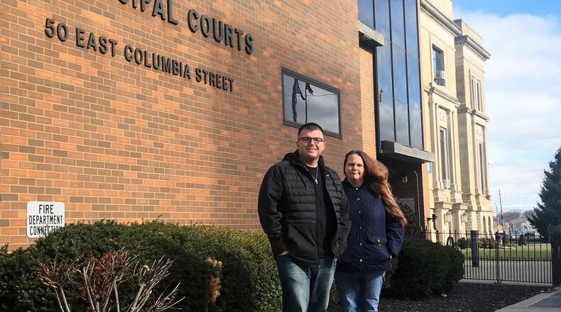 Eric Mata stands next to Tracie Bishop in front of the Clark County Municipal Court building. They formed the Substance Abuse Prevention Institute last year that offers programs to OVI offenders. HASAN KARIM/ STAFF