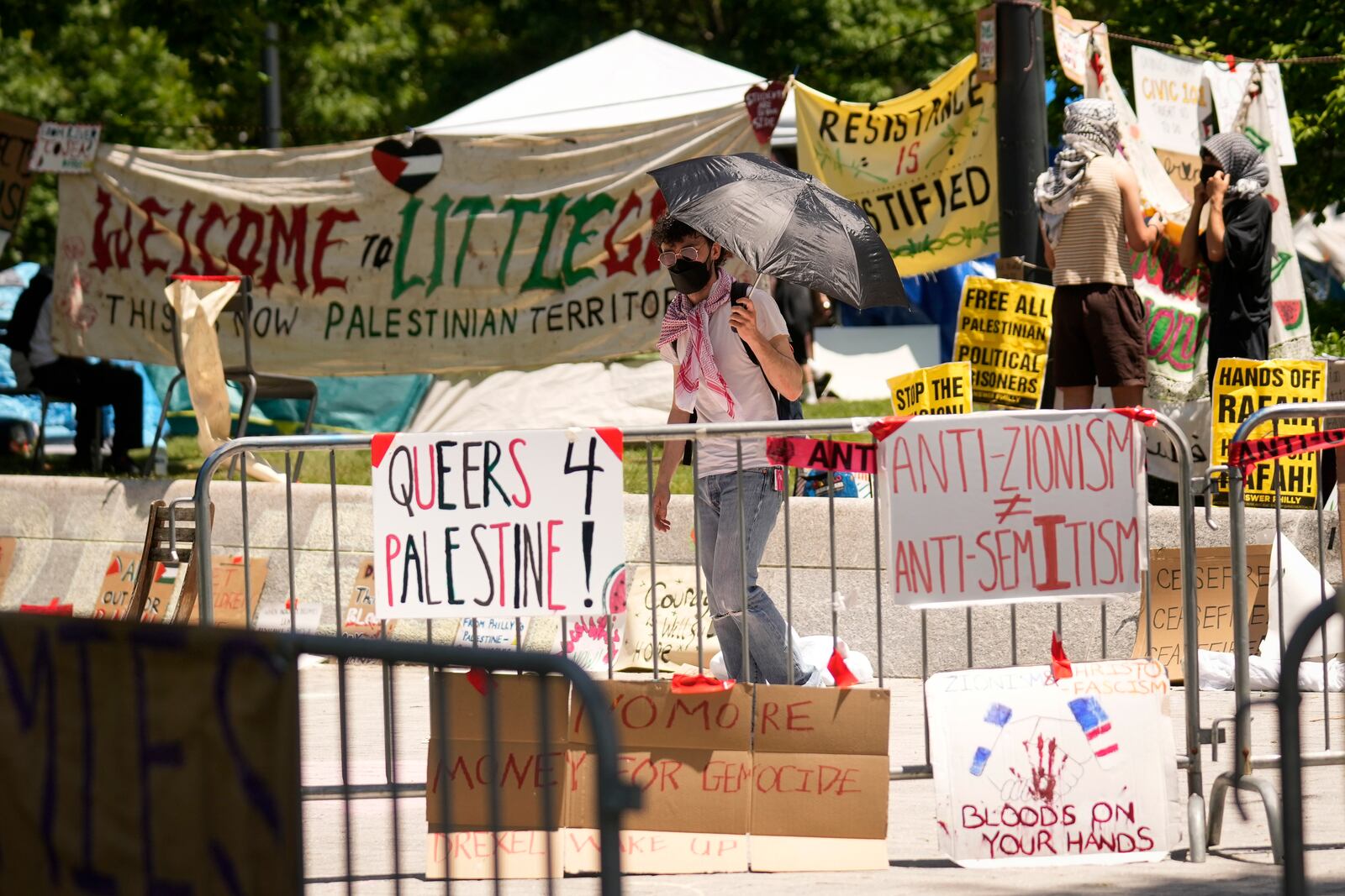 FILE - Tents and pro-Palestinian protesters occupy a quad at Drexel University, in Philadelphia, Tuesday, May 21, 2024. (AP Photo/Matt Rourke, file)