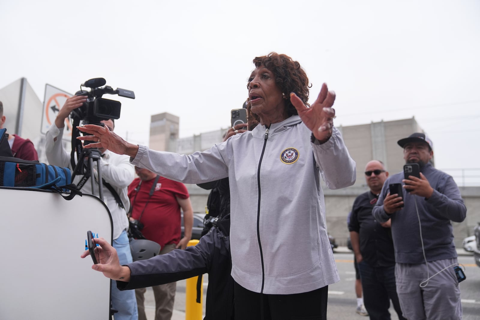 Congress Maxine Waters speaks to U.S. National Guard in downtown Los Angeles, Sunday, June 8, 2025, following last night's immigration raid protest. (AP Photo/Jae Hong)