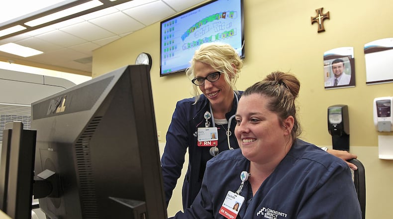 Nurses Holly Ogletree, left, and Rachelle Bowen look at a patients information of the My Chart program on the computer Friday Springfield Regional Medical Center. The hospital was recently recognized for its use of technology. Bill Lackey/Staff