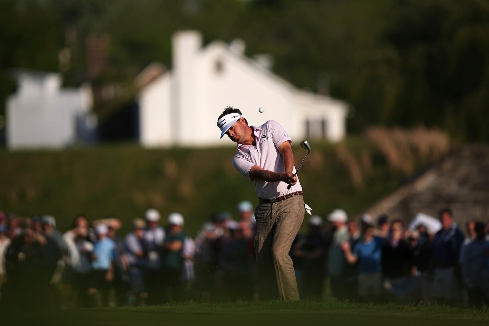 Keith Mitchell hits on the 18th hole during the third round of the Truist Championship golf tournament at the Philadelphia Cricket Club, Saturday, May 10, 2025, in Flourtown. (AP Photo/Matt Rourke)