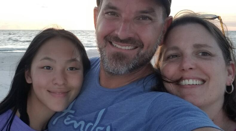 Lily Poynter, of Centerville, with her parents Bryan and Carrie Poynter.