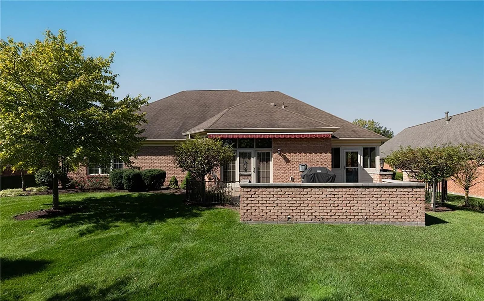 The back of the home features an expanded epoxy coated patio surrounded by a half brick wall and metal fence. CONTRIBUTED