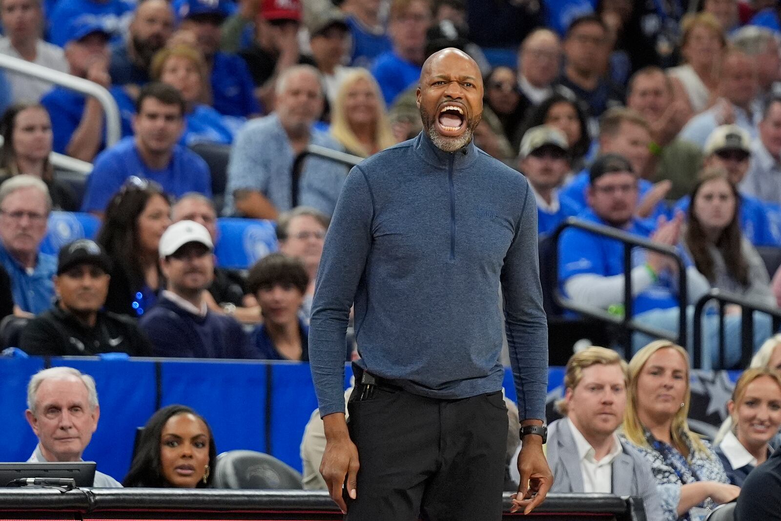 Orlando Magic head coach Jamahl Mosley shouts to his players during the first half of an NBA play-in tournament basketball game against the Atlanta Hawks, Tuesday, April 15, 2025, in Orlando, Fla. (AP Photo/John Raoux)