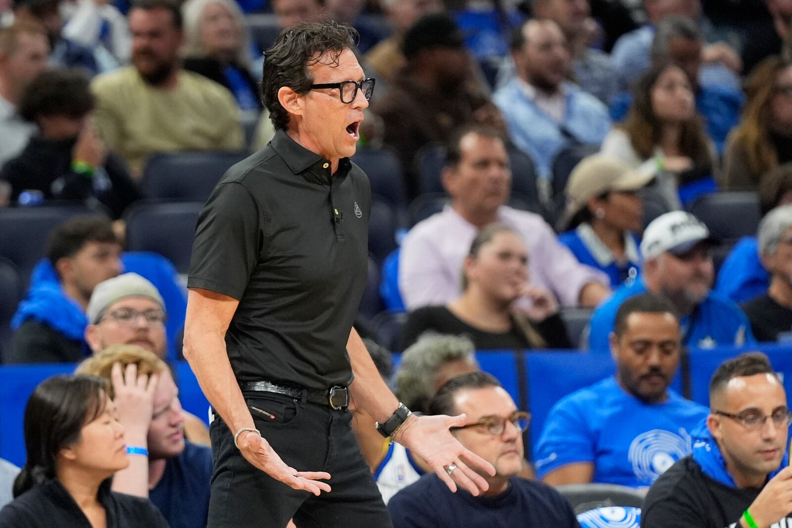 Atlanta Hawks head coach Quinn Snyder questions a ruling by officials during the first half of an NBA play-in tournament basketball game against the Orlando Magic, Tuesday, April 15, 2025, in Orlando, Fla. (AP Photo/John Raoux)
