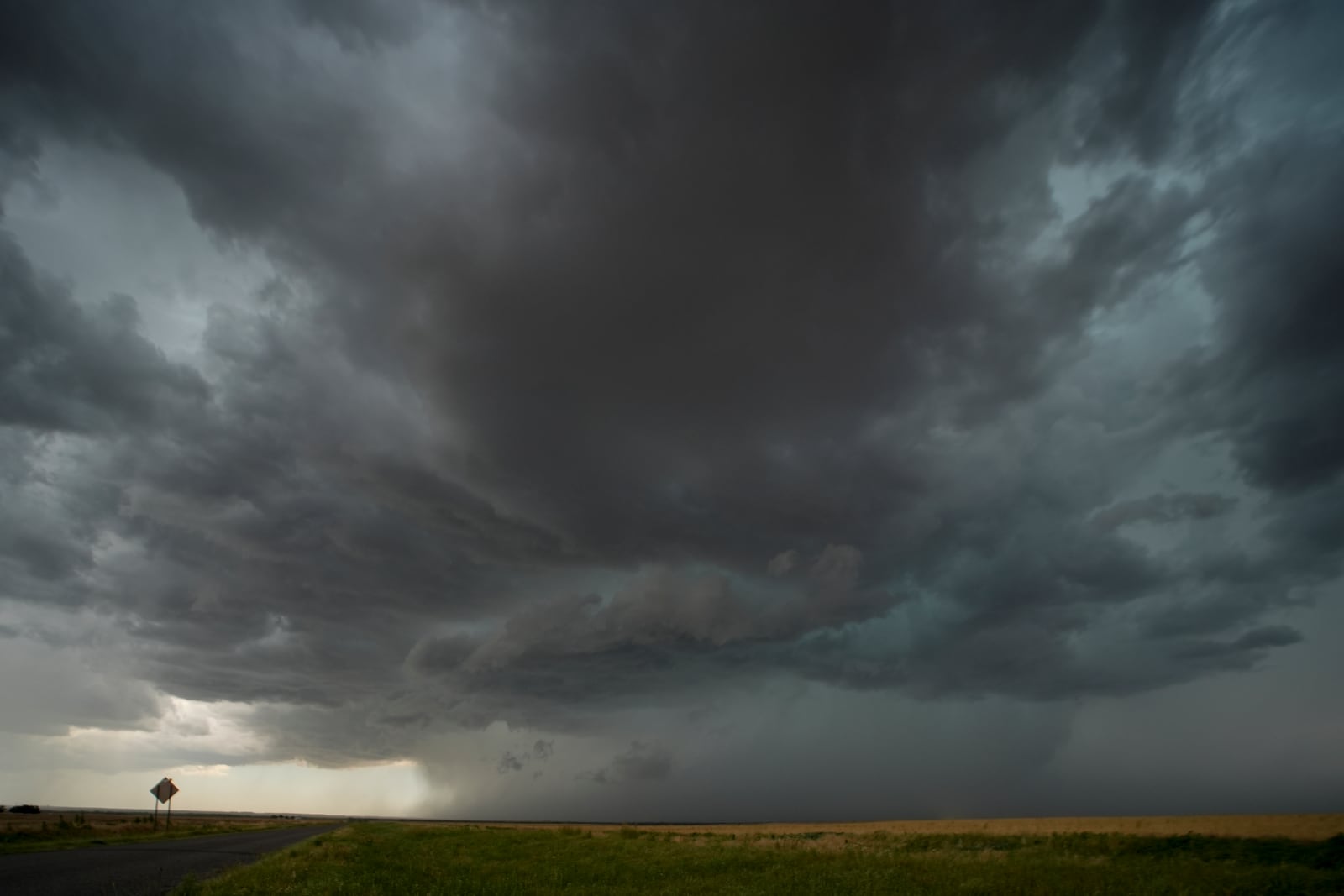 An approaching storm and rain shaft is visible during a Project ICECHIP operation Tuesday, June 3, 2025, near Tipton, Okla. (AP Photo/Carolyn Kaster)