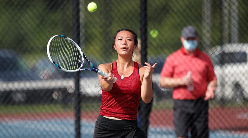 Northwestern senior Kate Pederson returns the ball during their season-opening match against Greeneview on Tuesday. CONTRIBUTED PHOTO BY MICHAEL COOPER