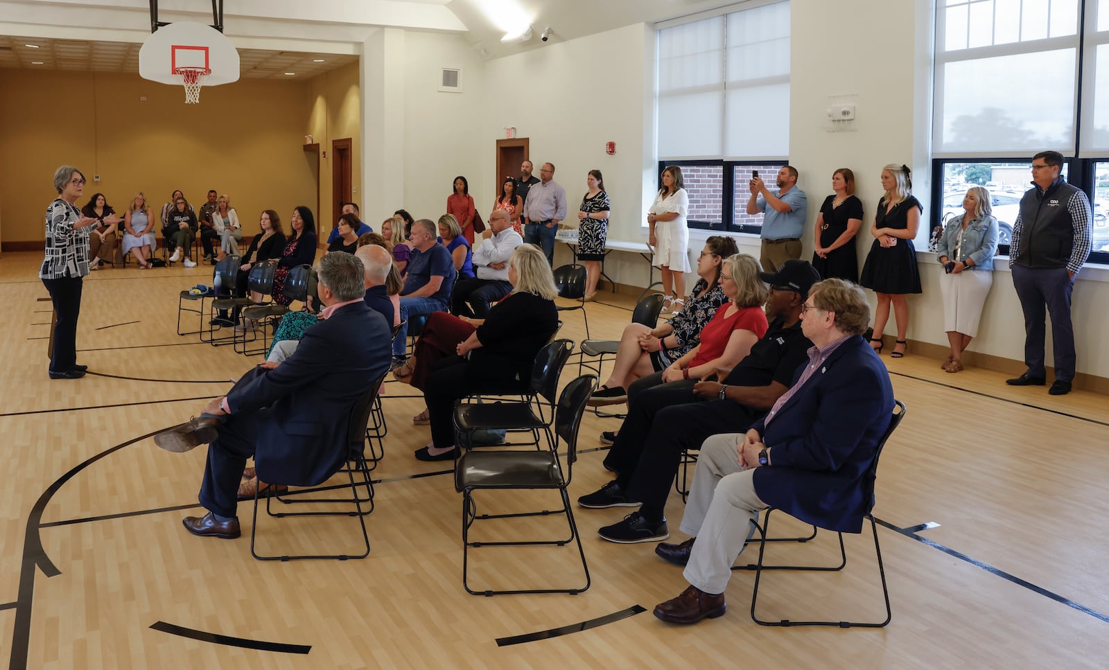 Virginia Martycz, left, Clark County Job and Family Services former director, speaks to an audience during the grand reopening of the $4.6M renovation project of the Home Road campus of the Clark County Department of Job and Family Services on Wednesday, August 20, 2025, in Springfield. JOSEPH COOKE/STAFF