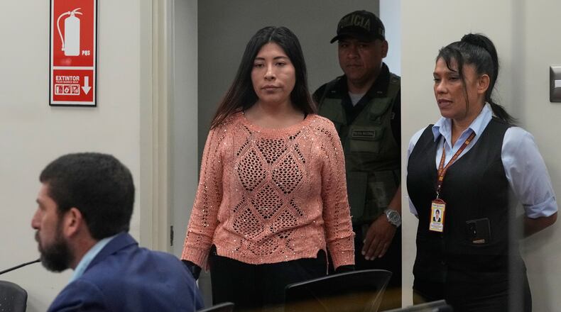 Peruvian former Prime Minister Betssy Chavez arrives for her trial on charges of rebellion and conspiracy against the state at a police base on the outskirts of Lima, Peru, Tuesday, March 18, 2025. (AP Photo/Martin Mejia)