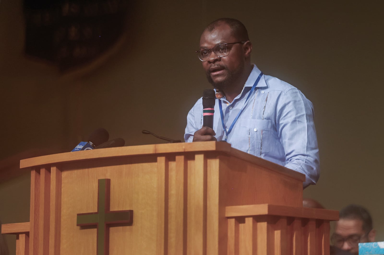 Viles Dorsainvil, co-founder and executive director of the Haitian Community Help & Support Center, speaks during Here We Stand: Faith Leaders for Immigration Justice & Family Unity at St. John Missionary Baptist Church on Monday, Feb. 2, 2026, in Springfield. Pastors, faith leaders and community members gathered to pray and call for the extension of Temporary Protected Status which is scheduled to expire on Tuesday, Feb. 3, 2026. JOSEPH COOKE/STAFF