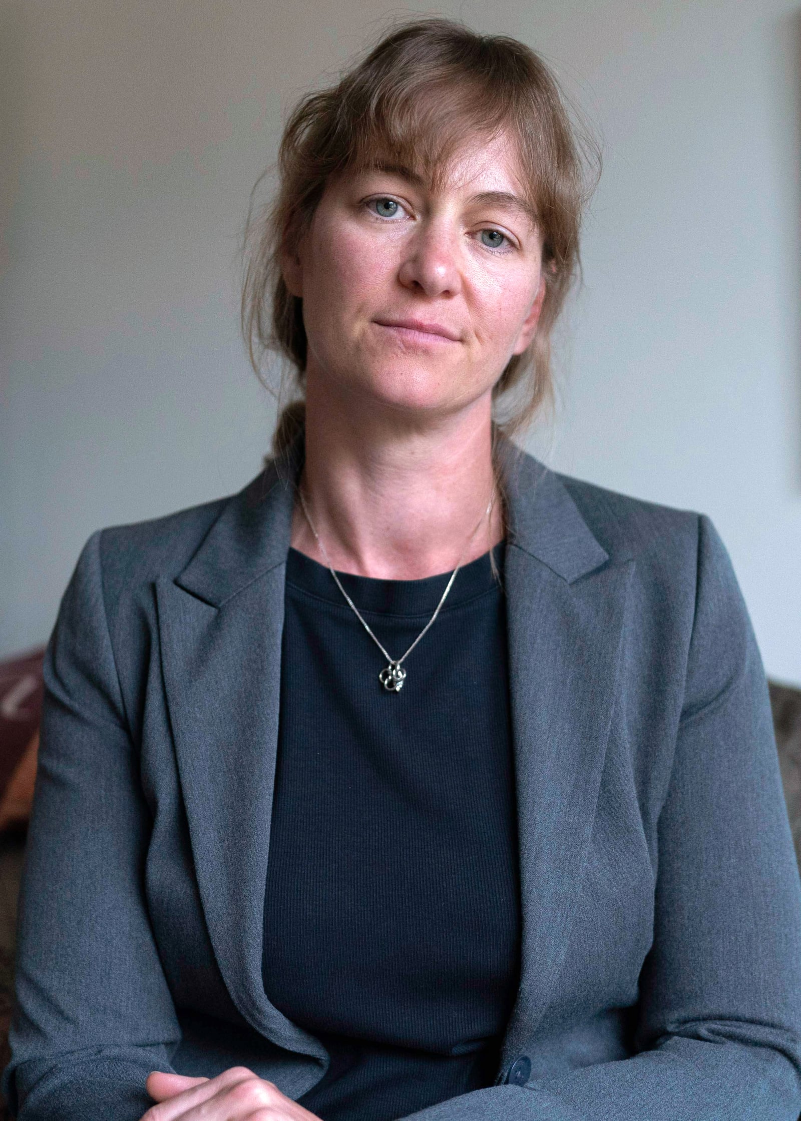 Jenna Norton, who works at the NIH as a researcher, poses for a photograph during an interview with the Associated Press in Bethesda, Md., Friday, June 6, 2025. (AP Photo/Jose Luis Magana)