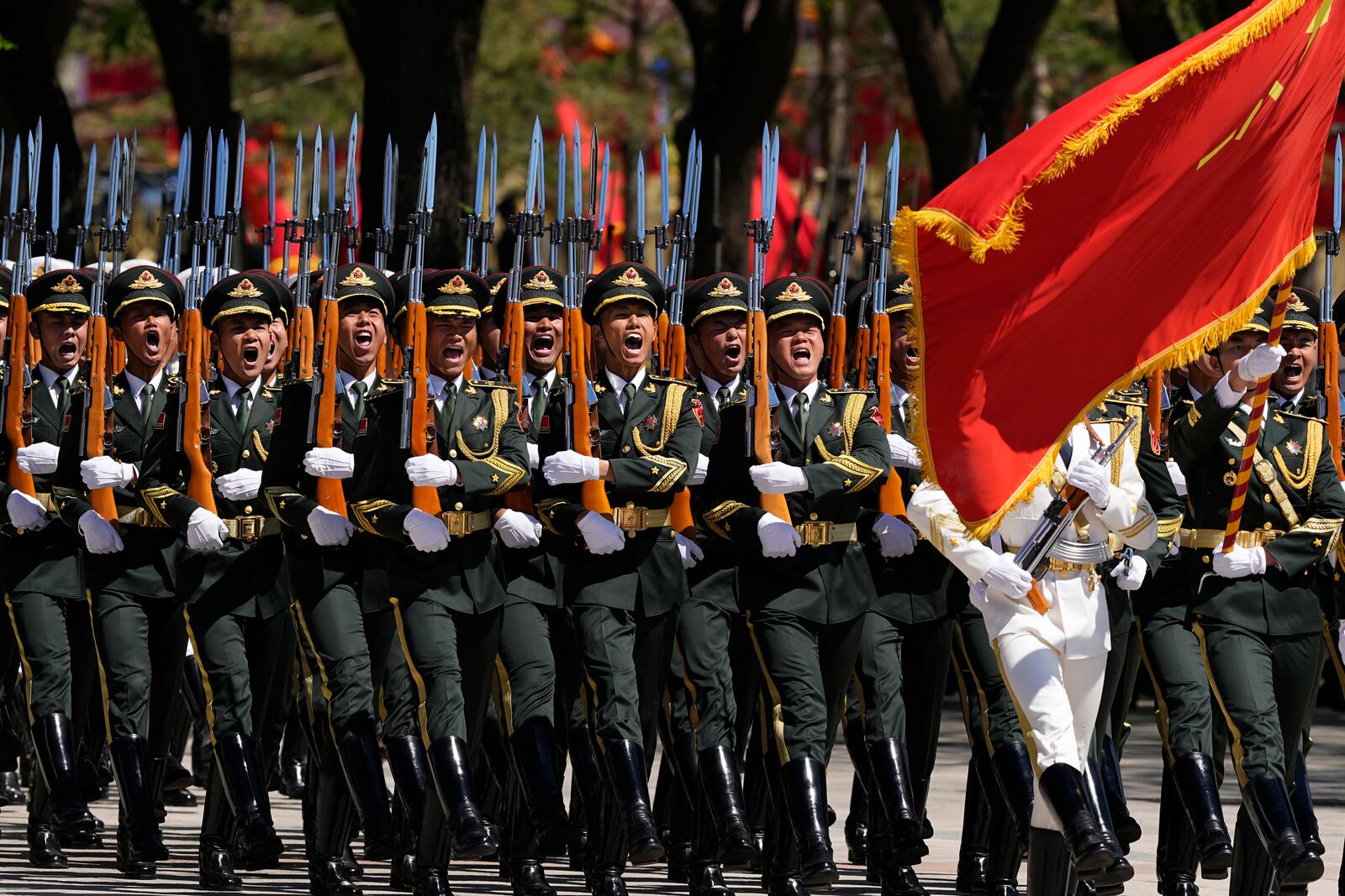 Chinese honor guards march during a welcome ceremony attended by China's President Xi Jinping and Kenyan President William Ruto at the Great Hall of the People in Beijing Thursday, April 24, 2025. (Iori Sagisawa/Pool Photo via AP)