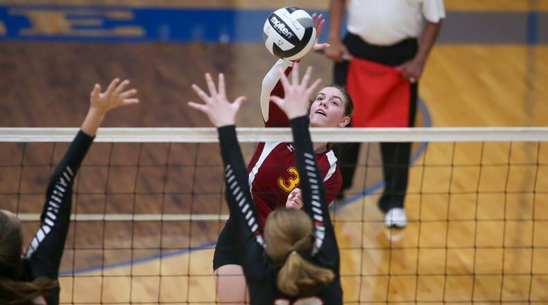 Northeastern High School senior Elizabeth Wiseman jumps to hit the ball during their Division III district semifinal game against Versailles on Tuesday night at Brookville High School. The Tigers won the match 25-22, 25-15, 21-25, 25-22. CONTRIBUTED PHOTO BY MICHAEL COOPER