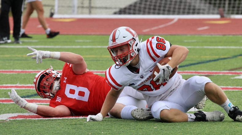 Jake Quosig, of SUNY Cortland, reacts after catching a touchdown against Wittenberg's Liam Wooldridge on Saturday, Sept. 4, 2021, at Edwards-Maurer Field in Springfield. David Jablonski/Staff