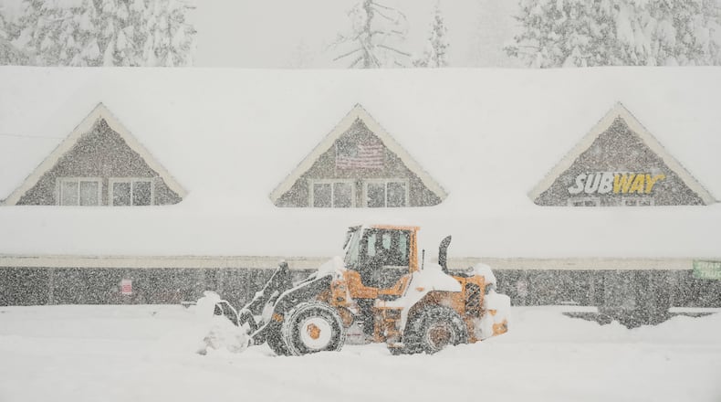 Snow is plowed in front of businesses during a snow storm Thursday, Feb. 19, 2026, in Soda Springs, Calif. (AP Photo/Godofredo A. Vásquez)