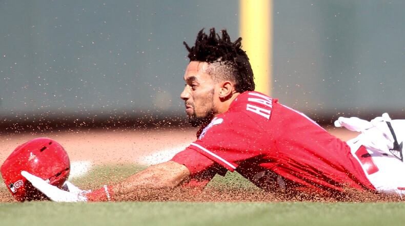 The Reds' Billy Hamilton steals third base against the Giants on Sunday, May 7, 2017, at Great American Ball Park in Cincinnati. David Jablonski/Staff