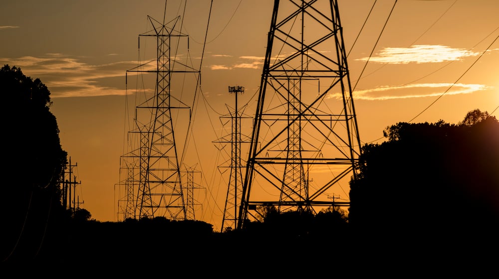 FILE – The sun sets behind power lines in Gaithersburg, Md., Oct. 23, 2020. (Samuel Corum/The New York Times)