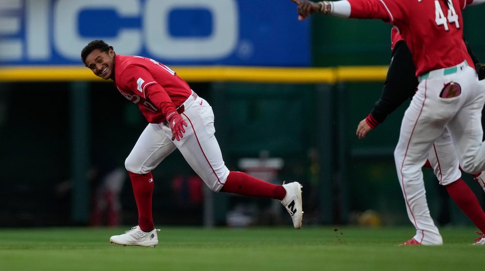 Cincinnati Reds' Dane Myers, left, celebrates with Elly de la Cruz after hitting a single to score winning run in the eleventh inning of a baseball game against the Boston Red Sox in Cincinnati, Saturday, March 28, 2026. (AP Photo/Carolyn Kaster)