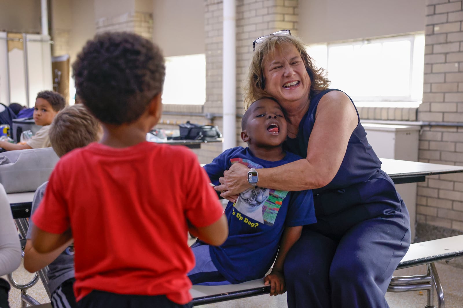 Springfield Sports Academy Principal Amy Fugate greets a young kid on Tuesday, July 1, 2025, at the Springfield Sports Academy. JOSEPH COOKE/STAFF