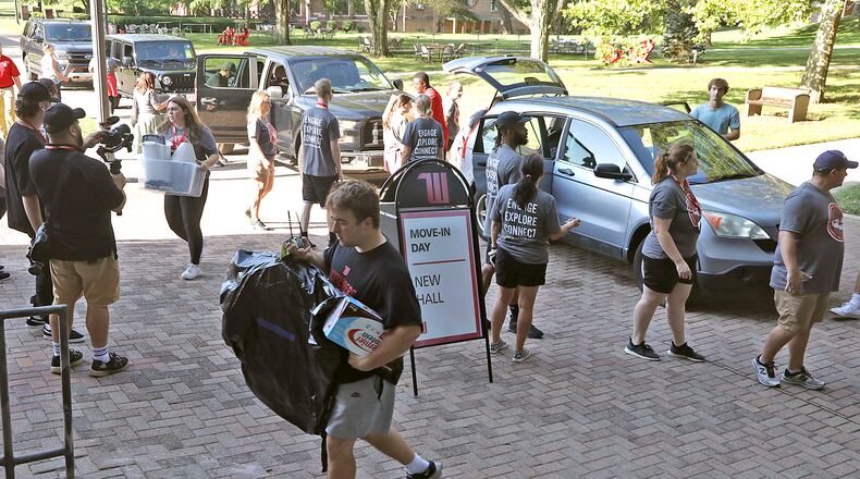 Wittenberg University students and faculty help new students move into their dorms Thursday, August 25, 2022 during Move-In Day on campus. Wittenberg's fall semester starts Monday, August 29. BILL LACKEY/STAFF