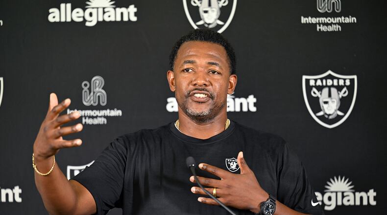 Las Vegas Raiders defensive coordinator Patrick Graham speaks with the media following practice at NFL football training camp, Thursday, July 25, 2024, in Costa Mesa, Calif. The Bengals reportedly interviewed Graham for their vacant defensive coordinator job on Wednesday. (AP Photo/John McCoy)