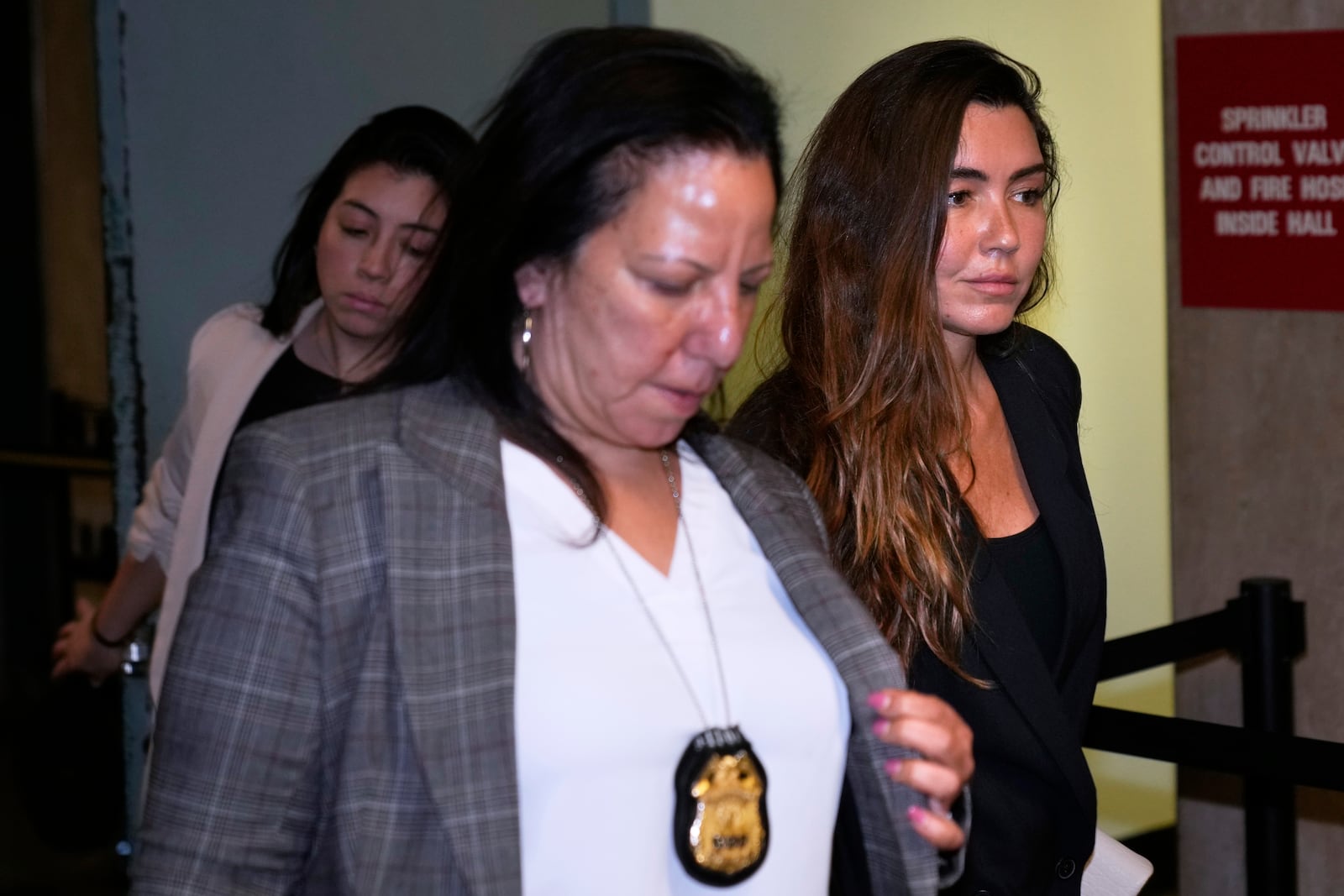 Miriam Haley, right, an accuser testifying at Harvey Weinstein's rape trial, leaves the courtroom during a break in New York, Wednesday, April 30, 2025. (AP Photo/Seth Wenig)