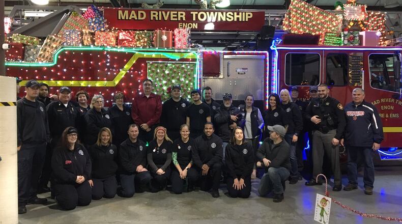 John Clark Jr. in the red shirt in the middle of the group is welcomed back by his fellow firefighters, and emergency medical personnel, cadets, and auxiliary members.